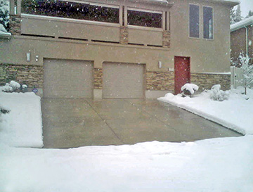 A heated concrete driveway following a snowstorm.