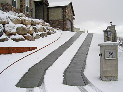 Heated driveway with two 24-inch wide heated tire tracks.