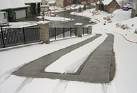 Heat two tire tracks in the driveway.