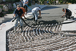 Heated concrete driveway being installed.