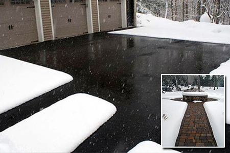 Heated asphalt driveway and walks, with inlay of heated paver walkway after a snowstorm.