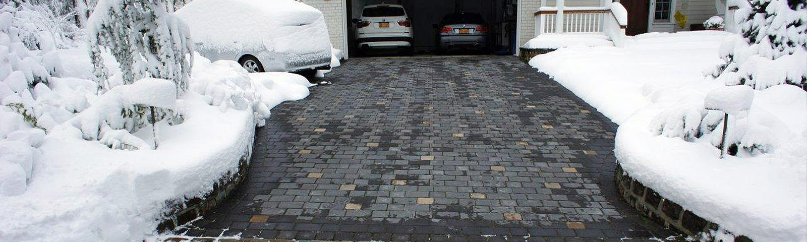 A heated paver driveway after a snowstorm.